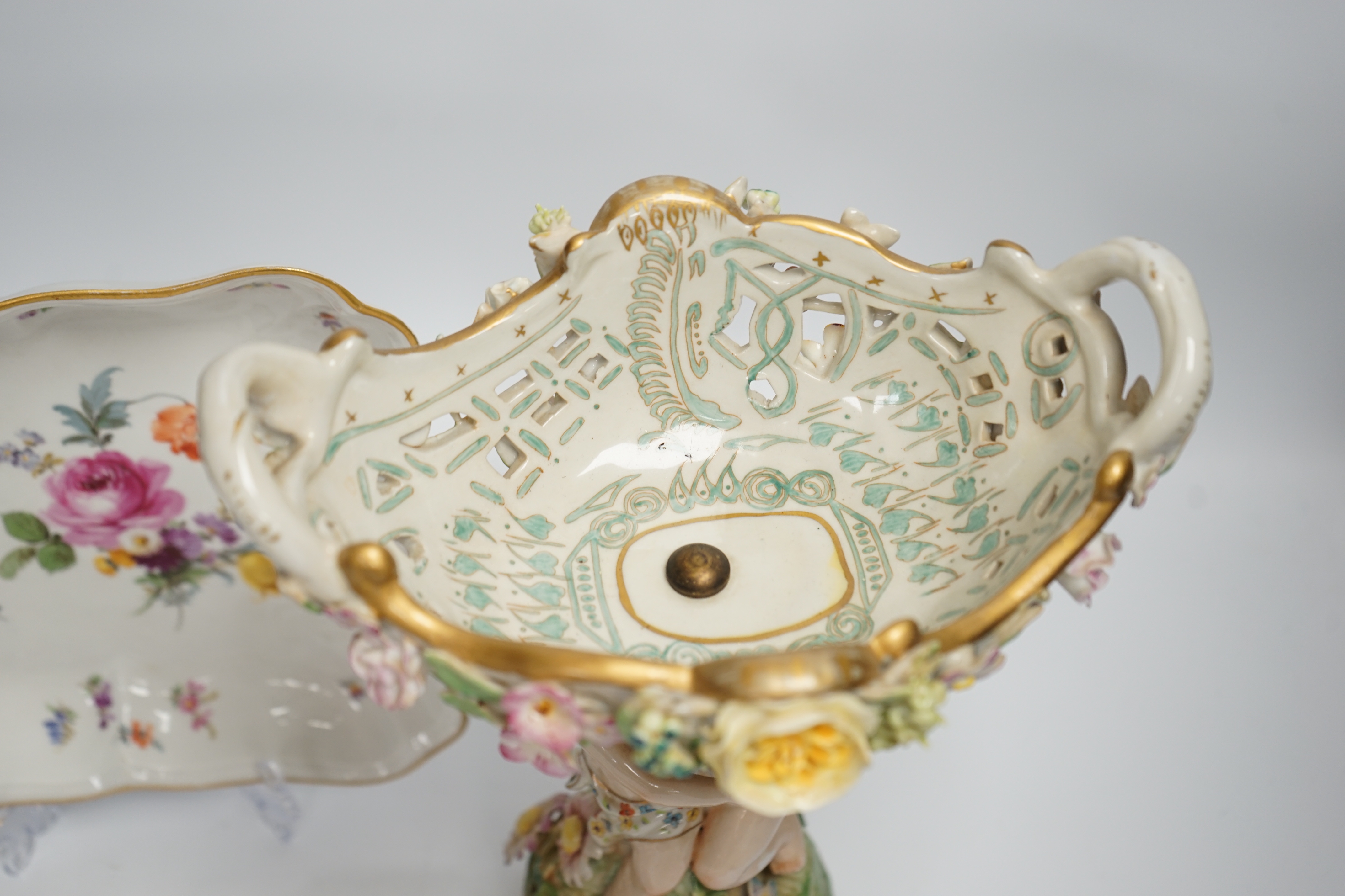 A German porcelain figural centrepiece, a Meissen floral dish, and various Dresden dishes, tallest 29cm